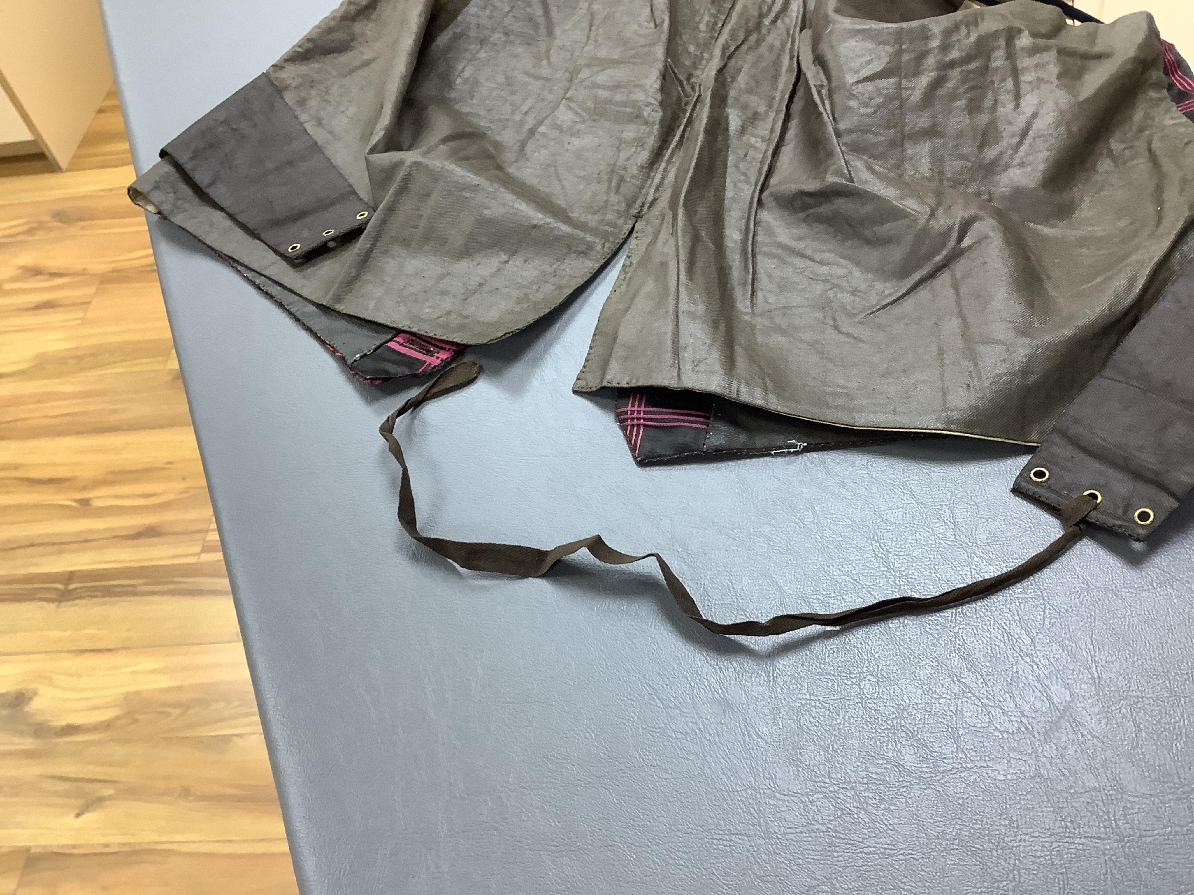 A 19th century gentleman's pink and black silk check waistcoat, with collar and two pockets. Front under arm chest 50cm. Condition - lining stained may need professional cleaning.